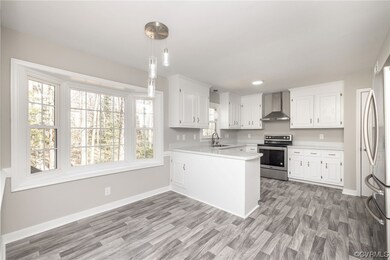 Kitchen featuring decorative light fixtures, wall