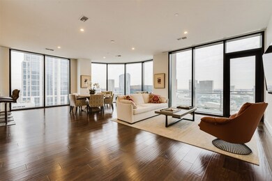 Spacious living area with hardwoods, recessed ligh
