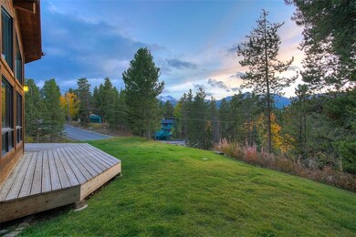 Patio out front with lawn and ski area views