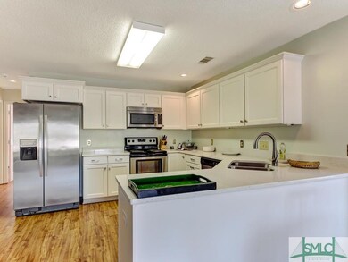 Kitchen with upgraded cabinets, countertops, refri