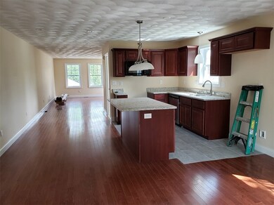 Kitchen looking into living room
