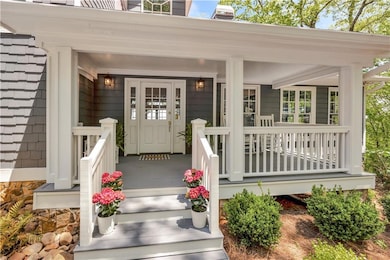 Entrance to property featuring a porch