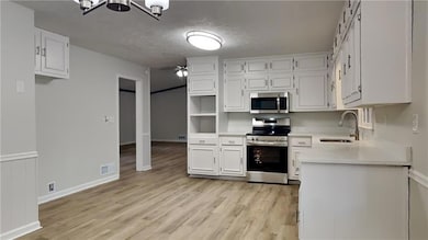Kitchen with stainless steel appliances, ceiling f