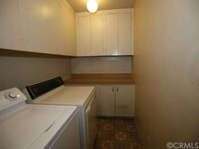 laundry room with lots of cabinets