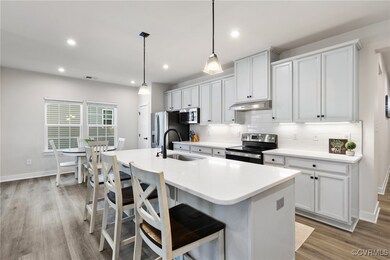 Kitchen with a kitchen breakfast bar, stainless st
