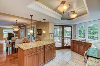 Kitchen looking back into the breakfast room and c