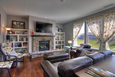 This is the Great Room, which has a gas fireplace with a stone surrounding, plus build-in shelves on both sides. The 55