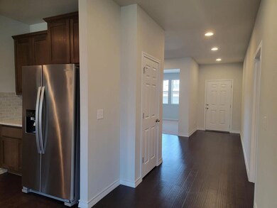 Kitchen featuring stainless steel refrigerator wi