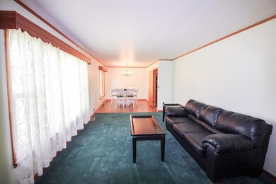 Formal living room and formal dining room with large picture window