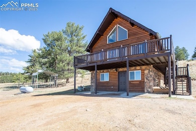 View of front of property with stairway, a deck, a