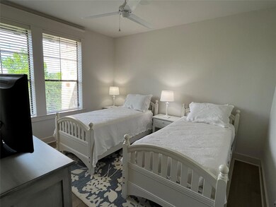Bedroom featuring baseboards and ceiling fan