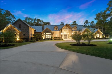 The stone and brick exterior is accented with ceda