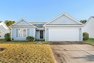 Ranch-style house with a front lawn and a garage