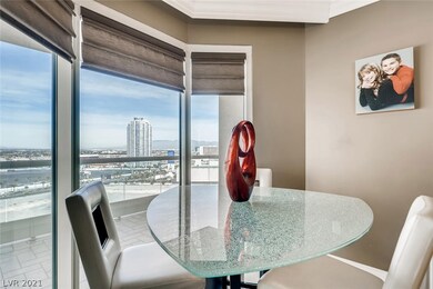 Dining area with floor-to-ceiling windows.