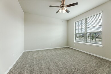 Sophisticated Study with plush carpet, ceiling fan