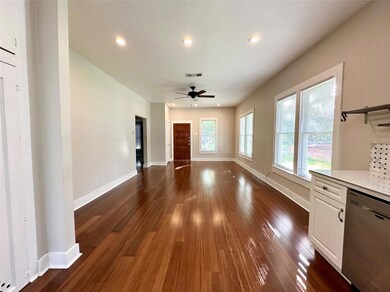 Unfurnished living room with dark wood finished f