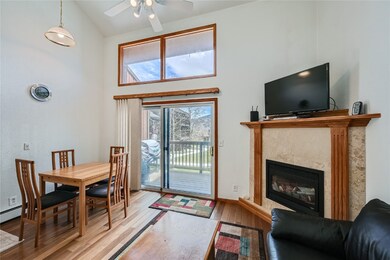 Living room with high vaulted ceiling, hardwood /