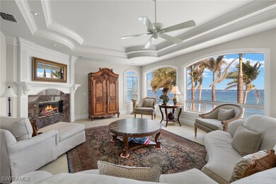 Living room with visible vents, a raised ceiling,