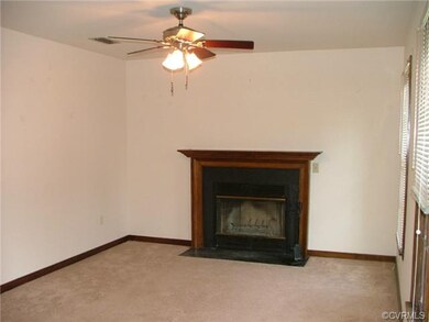 The Living Room has W-W-Carpet, Ceiling Fan and a 