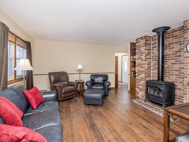 Living room on main level with new flooring, and l