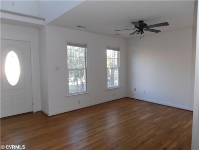 Living Room - Hardwood floor, lighted ceiling fan,