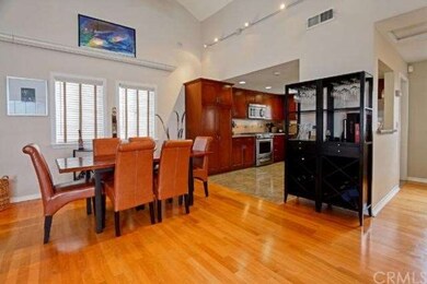 Formal dining room under track lighting opens up t