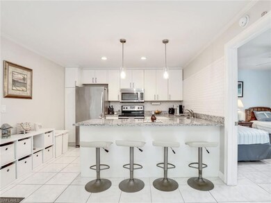 Kitchen featuring light tile flooring, kitchen pen