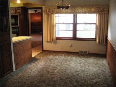 Wood floors under carpet in living, dining, hall a
