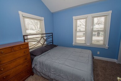 Master bedroom with cathedral ceilings.