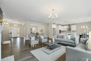 Living area featuring a chandelier, dark wood-style floors, and recessed lighting