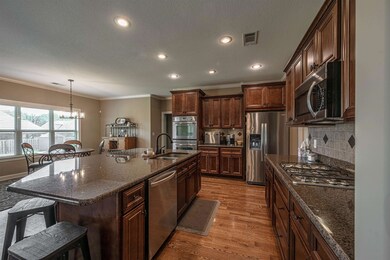 Kitchen featuring a kitchen breakfast bar, a cente