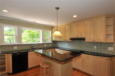 Kitchen with granite counters and high quality cabinetry