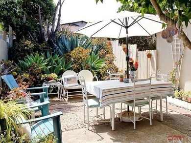 The protected and colorful front courtyard is an e