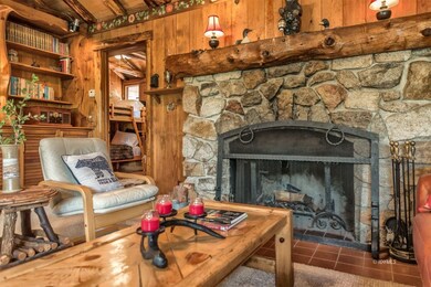 Rock fireplace with pine mantel