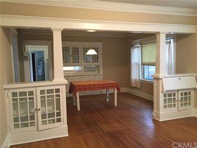 Living room with built in book shelves and desk an