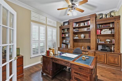 Formal office with built ins and wood floors
