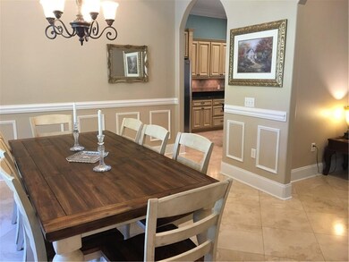 Dining room with view into kitchen and main living