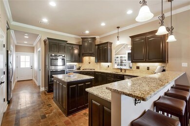 Gourmet kitchen is adorned with s/s appliances inc