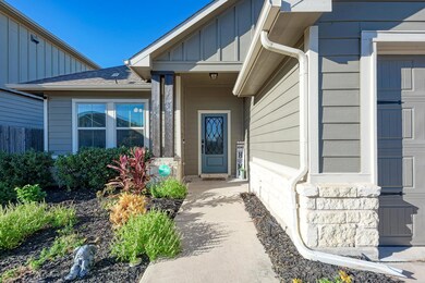 Doorway to property with a shingled roof