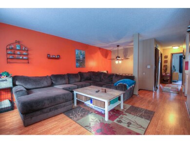 Spacious living room with newer flooring.