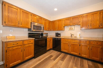 Cabinets galore with granite.