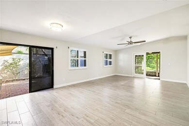 Living area from the kitchen with sliders to the p
