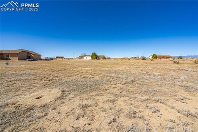 View of yard with a rural view