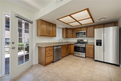 Kitchen with appliances with stainless steel finis