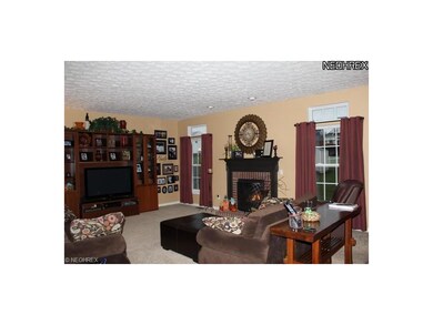 Huge great room with gas fireplace which is open t