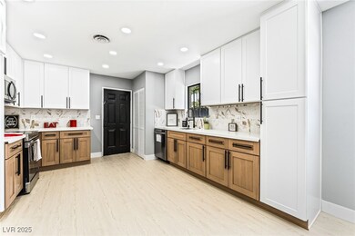 Kitchen with appliances with stainless steel finis