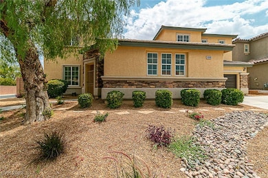 View of front of house with stone siding, stucco siding, a garage, and concrete driveway