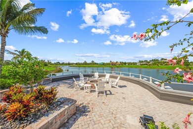 View of patio featuring a water view and a fire pit
