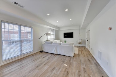 Living area featuring light wood finished floors, 