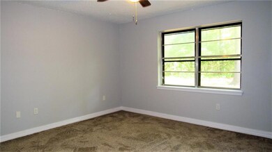 Master bedroom has new carpet, paint, fans, switch